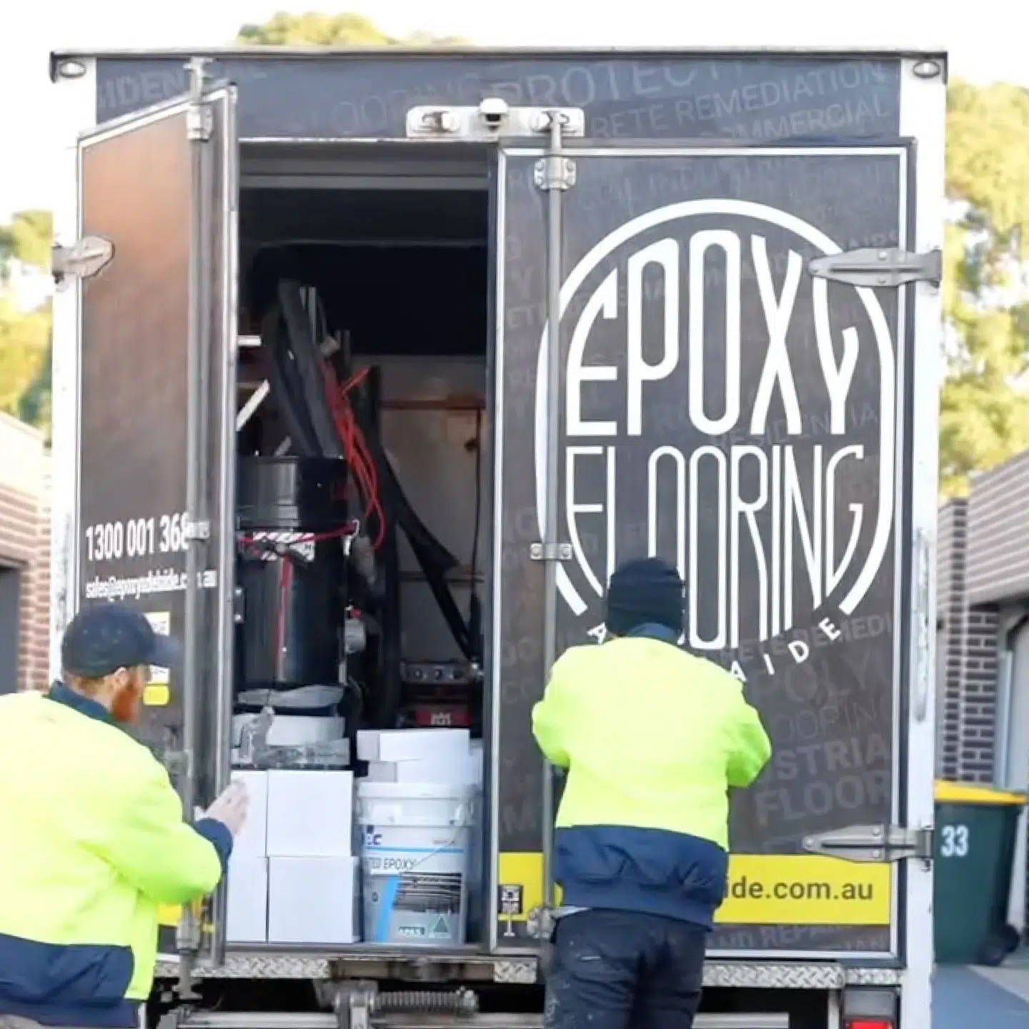 Epoxy Flooring Crew Unloading Equipment On Site