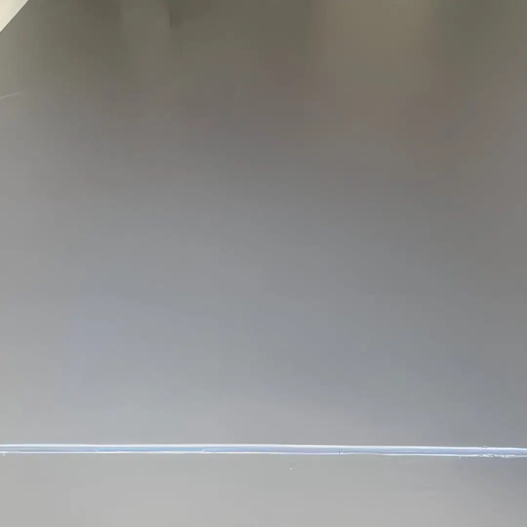 Freshly coated gray epoxy floor with a smooth glossy finish